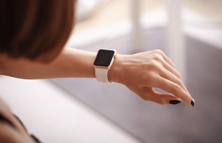 Woman looking down at watch