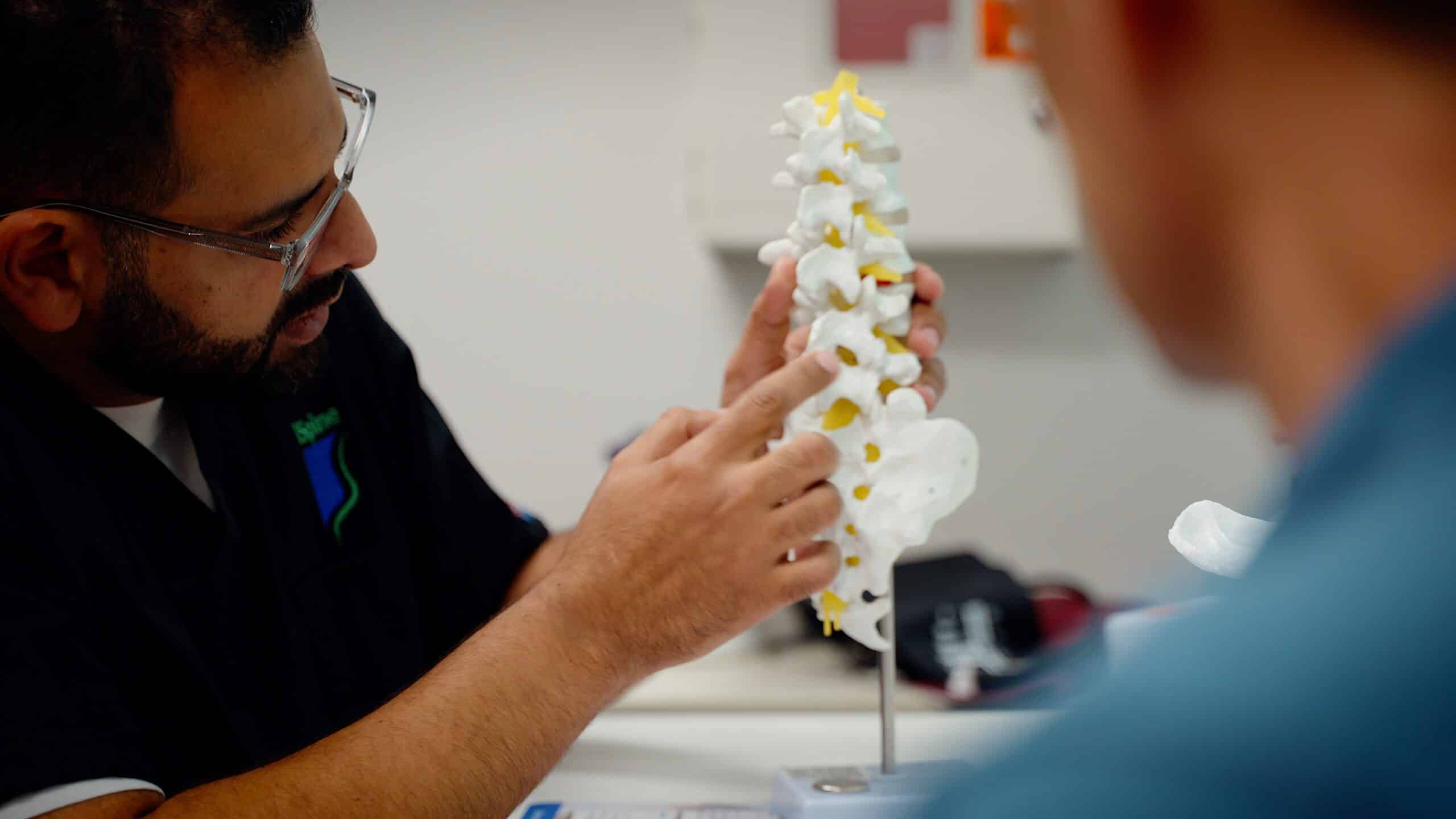 Dr Faltas iSpine Clinics explaining spine to patient Dr Faltas iSpine Clinics explaining spine pain to patient