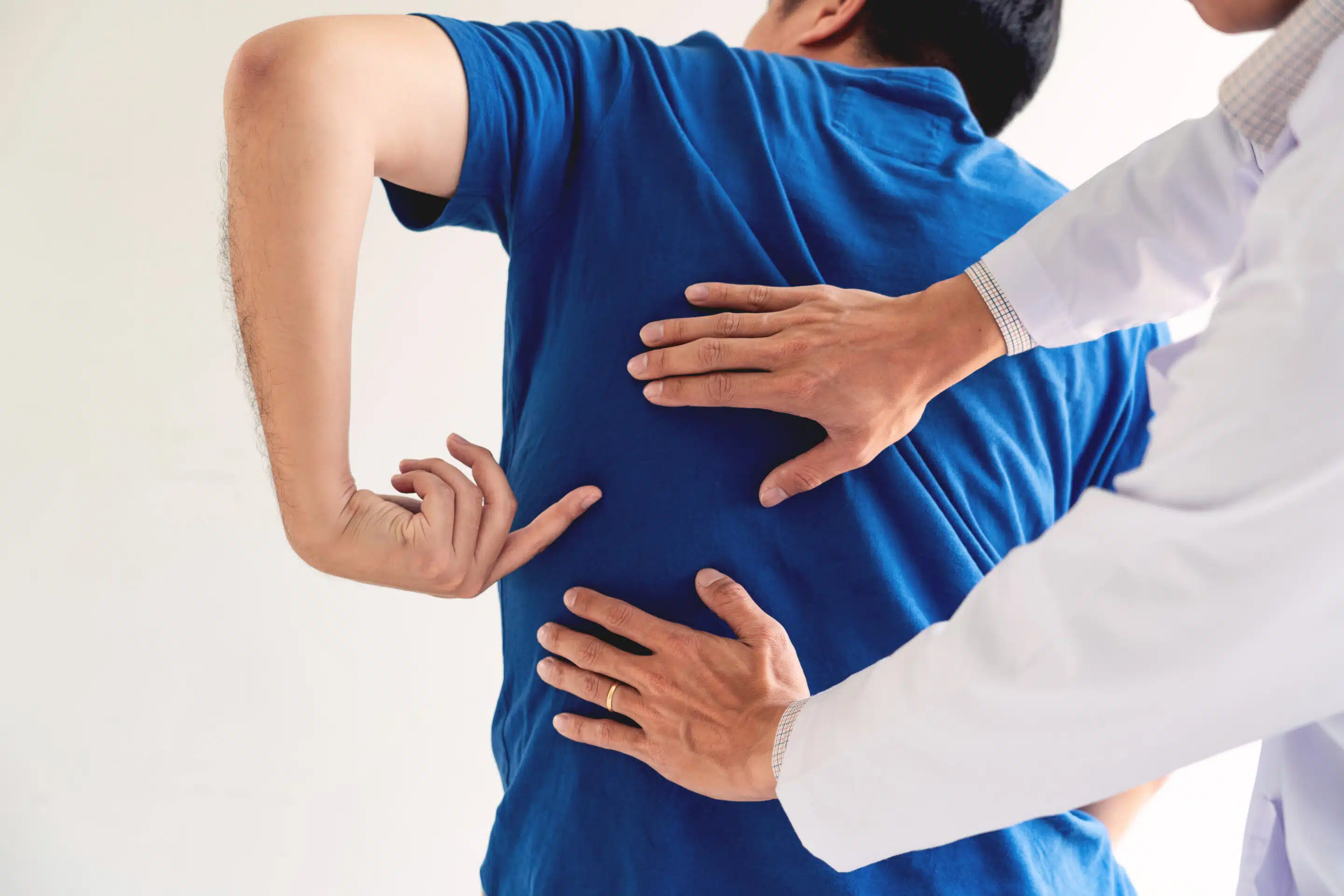 Physiotherapist,Working,Concept,,Doctor,And,Patient,Suffering,Or,Chiropractor,Examining Some of the most common questions about chronic pain