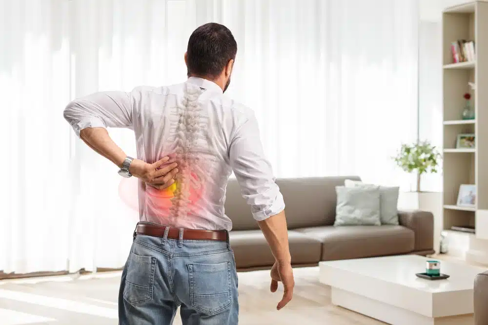 Rear,View,Shot,Of,A,Man,With,Painful,Back,Standing